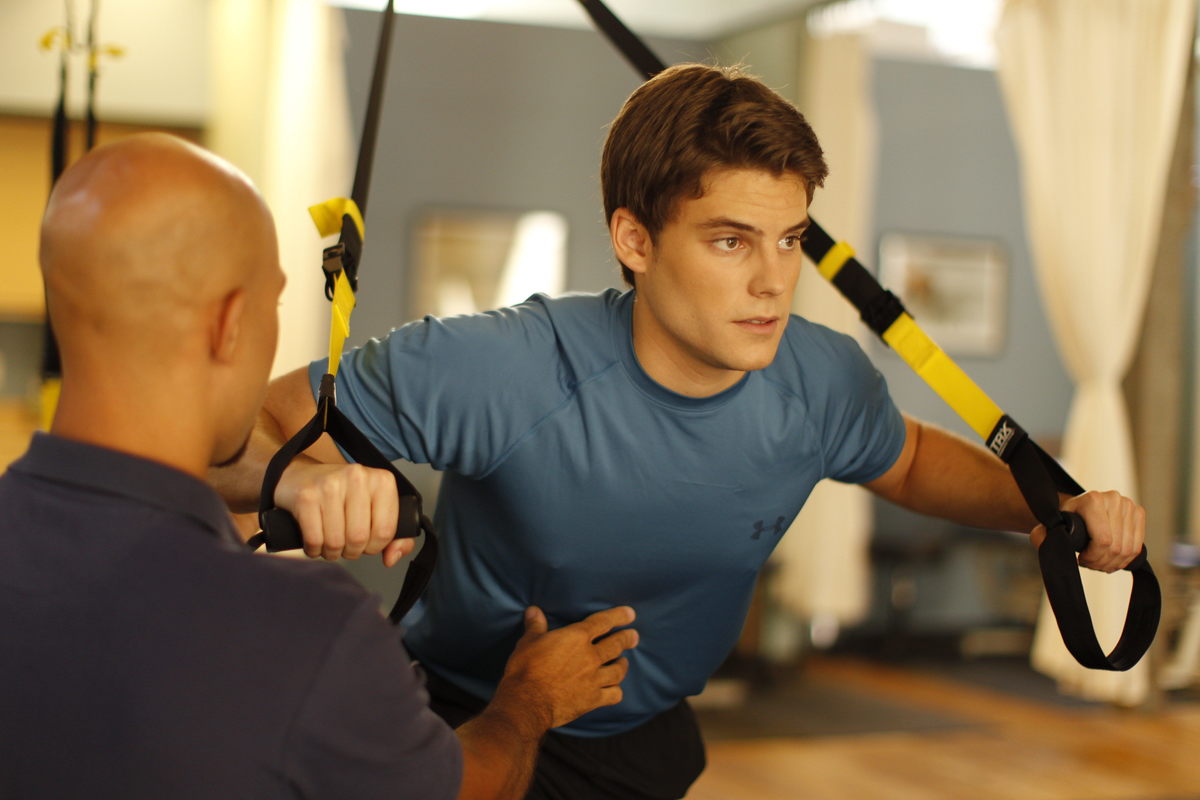 man doing trx chest press