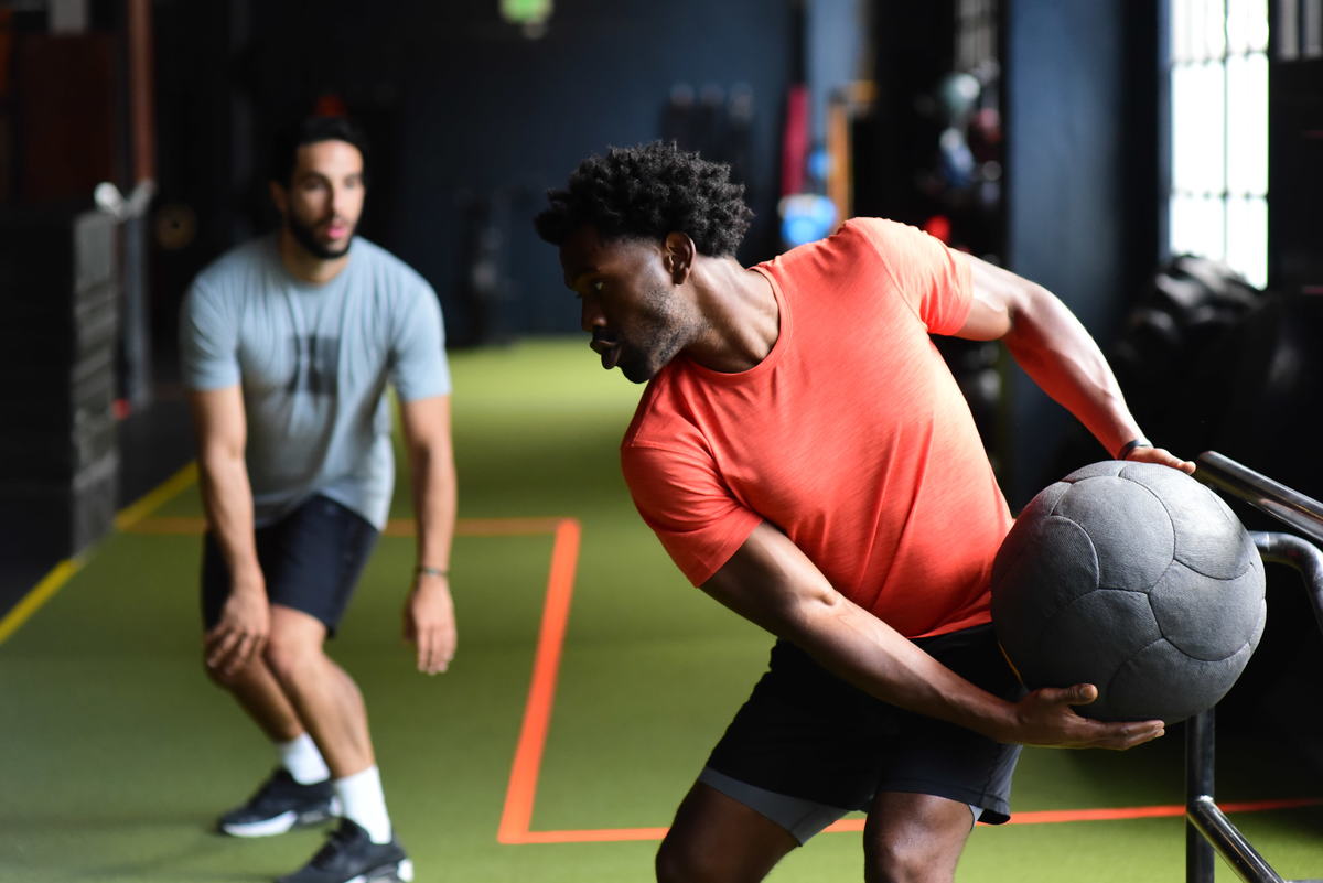 person throwing medicine ball